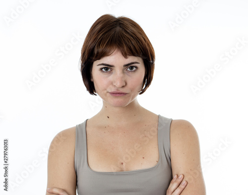 Portrait of a beautiful young woman with angry and harsh face. Human expressions and emotions