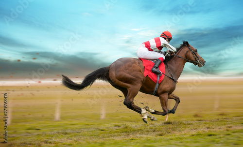 Fotografie, Obraz Race horse with jockey on the home straight. Shaving effect.