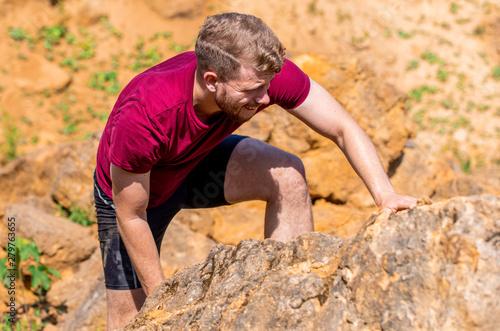 Runner during obstacles course training in the boot camp