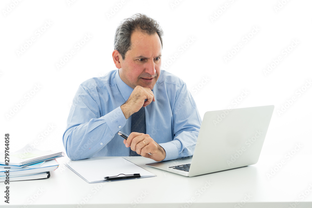 Overwhelmed and tired mature businessman working at office feeling stressed and headache Overwhelmed and tired mature businessman working at office feeling stressed and headache