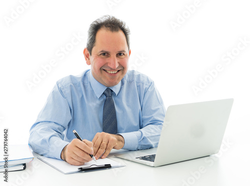 Attractive happy mature caucasian businessman working on laptop computer feeling successful at work