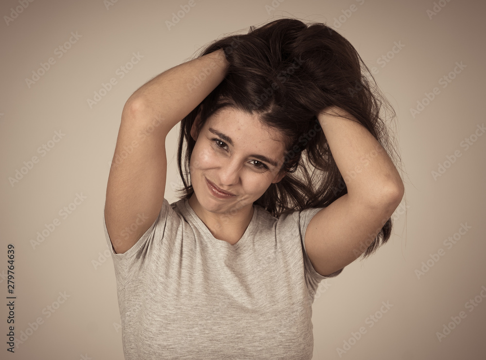 Fototapeta premium Portrait of young attractive woman with happy and smiling face. Beauty concept and lifestyle