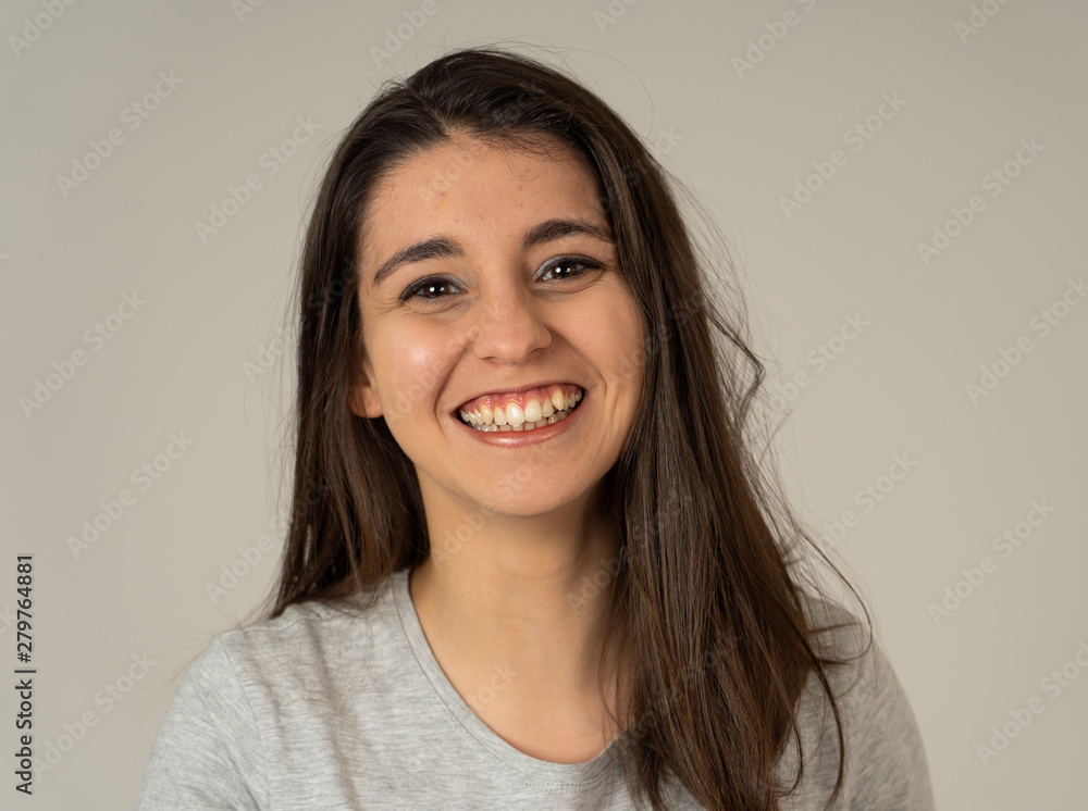 Portrait of young attractive cheerful woman with smiling happy face. Human expressions and emotions Portrait of young attractive cheerful woman with smiling happy face. Human expressions and emotions