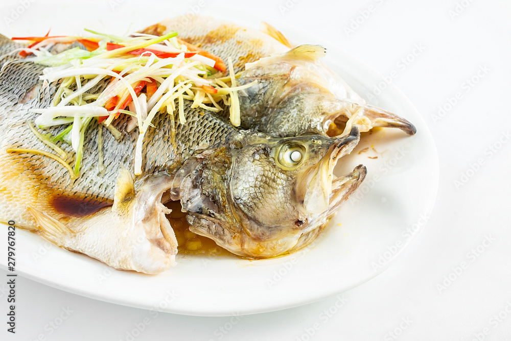 Chinese Cantonese cuisine dish with steamed squid on white background