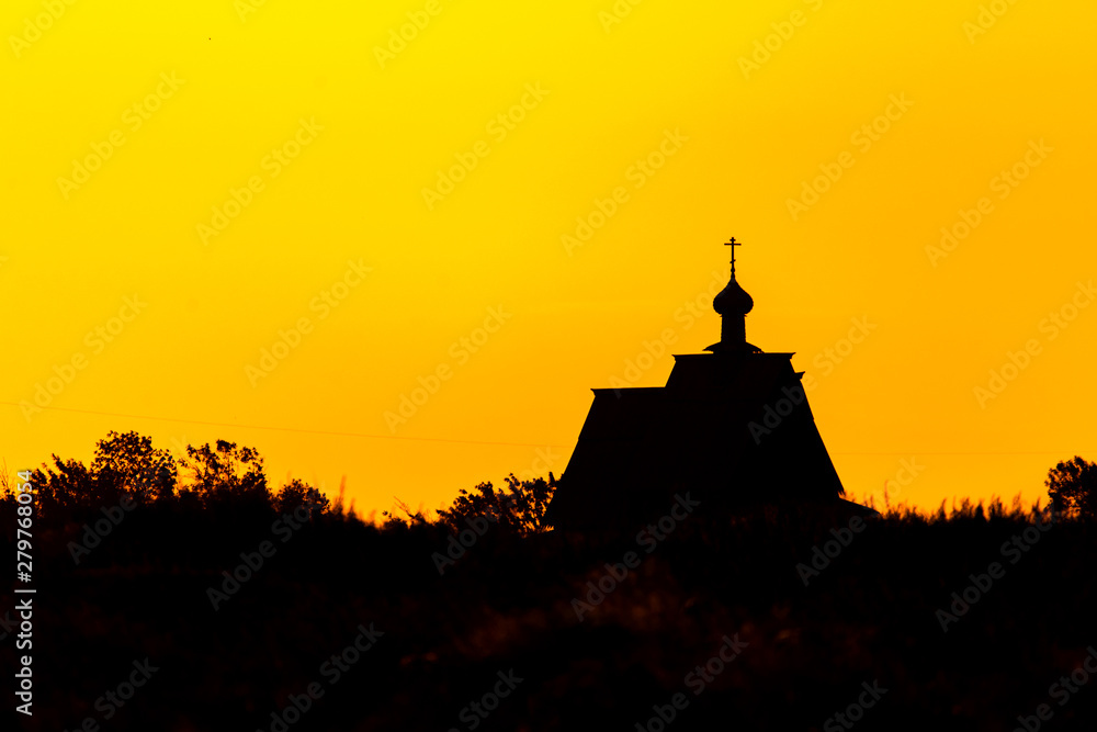 Sunset church cross silhouette in sunset sky clouds. Sunset church silhouette.