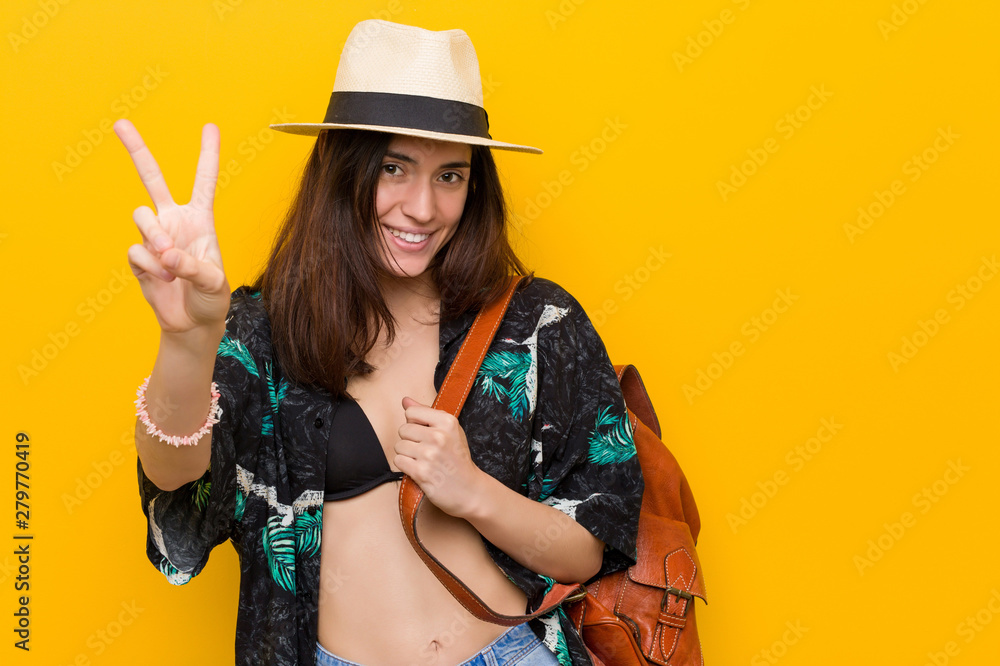 Young caucasian woman wearing a bikini and hat Young caucasian woman wearing a bikini and hat