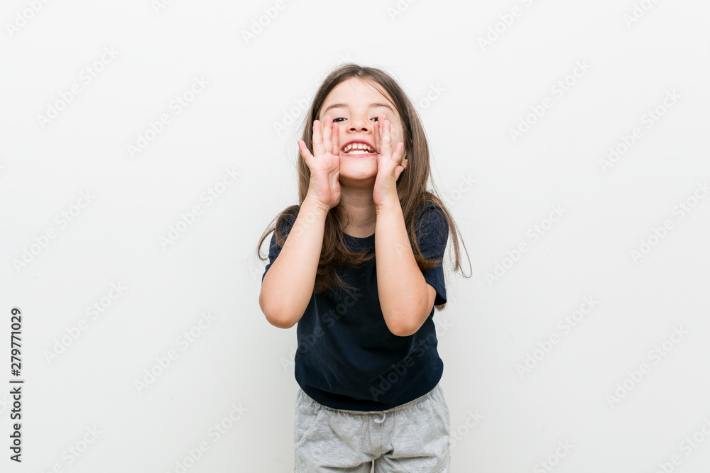 Cute little caucasian girl shouting excited to front. Cute little caucasian girl shouting excited to front.