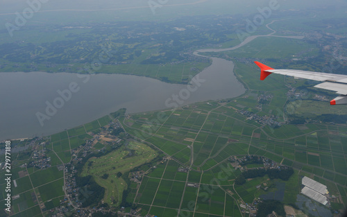 Flying over rural scenery in summer day