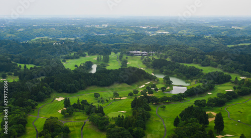 Flying over rural scenery in summer day