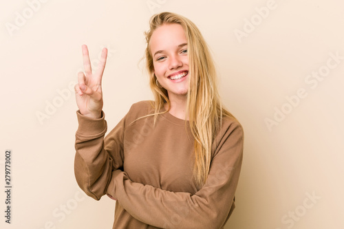 Wallpaper Mural Cute and natural teenager woman showing number two with fingers. Torontodigital.ca