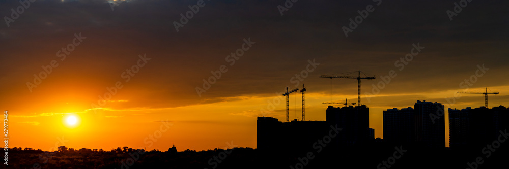 Construction Site of apartment house on sunset