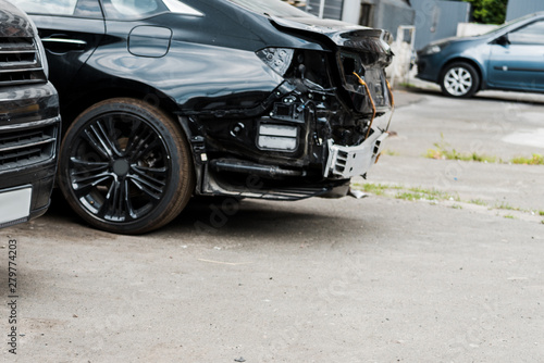 crashed vehicle after car accident near modern automobiles © LIGHTFIELD STUDIOS