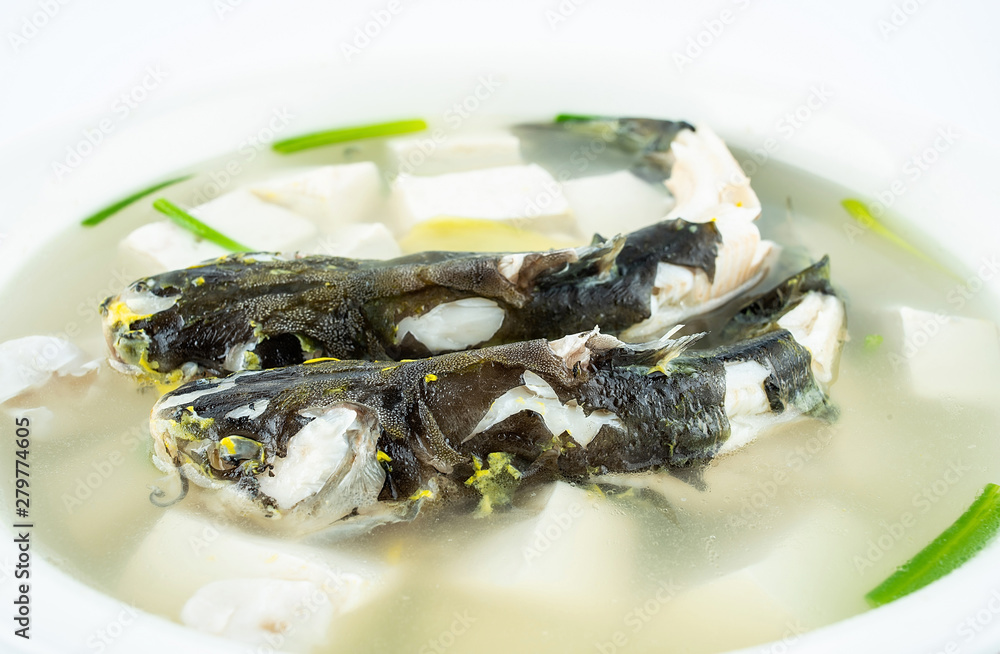 Chinese gourmet fish soup, a large bowl of tofu yellow bone fish soup on a white background