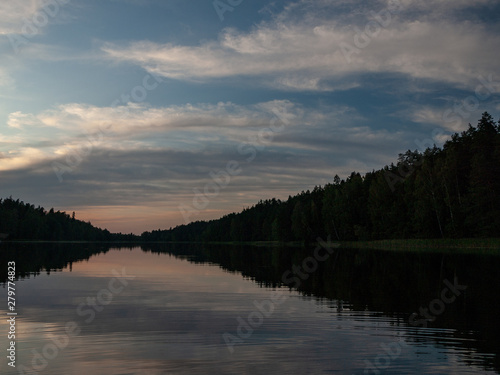Fototapeta Naklejka Na Ścianę i Meble -  sky after sunset, dark forest silhouette, selective focus close up