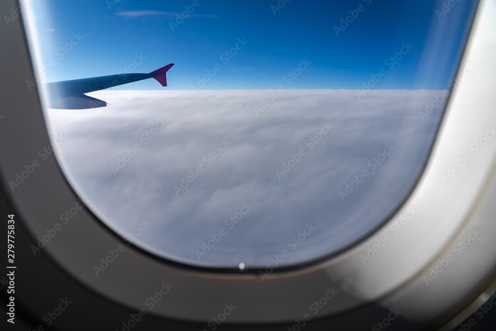 The window of the airplane. A view of porthole window on board an airbus for your travel concept or passenger air transportation