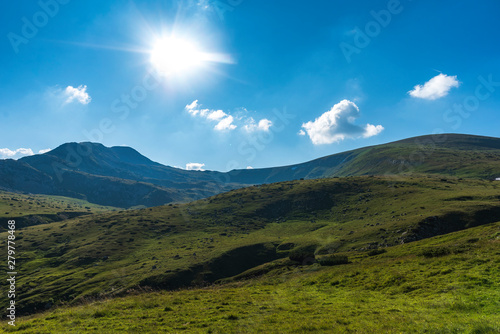 Panoramic photo of summer mountain valley. Fabulous warm day in the mountains, amazing nature. Travel and hike