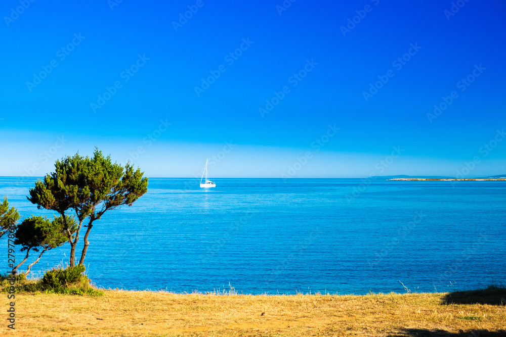 Beautiful seascape on Adriatic sea in Croatia, Dugi otok island, sailing boat on sea in bay on Veli Rat