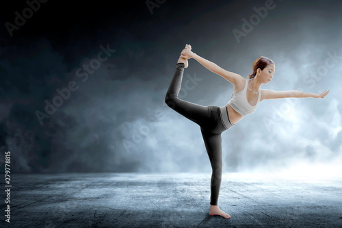 Asian healthy woman practicing yoga on indoor