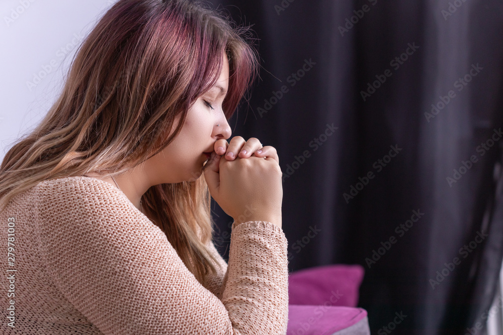 Close-up on depressed young woman crying in house, against blurred background. Close-up on depressed young woman crying in house, against blurred background.