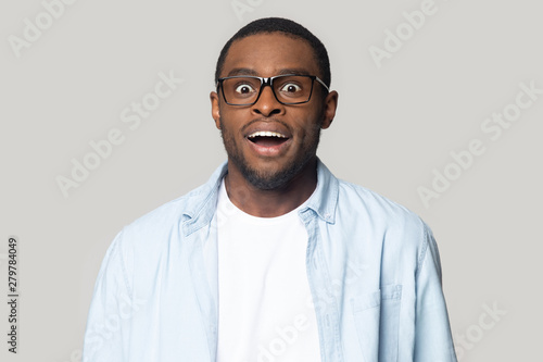 Surprised african American man feel amazed with news
