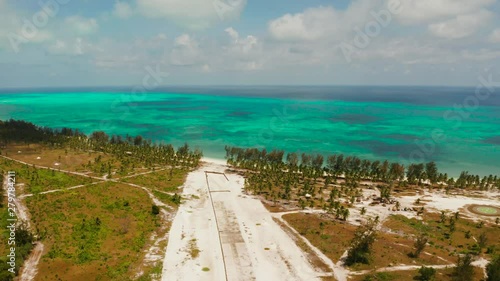 Construction of the runway of the local airport on a tropical island. Construction of a landing strip. Balabac, Palawan, Philippines. photo