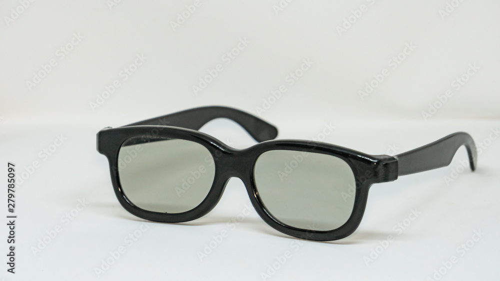 Side view of black glasses, clear glass, placed on a white background. Side view of black glasses, clear glass, placed on a white background.