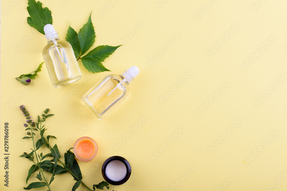 Beautiful layout of cosmetic products on a yellow background. Natural cosmetics for face and body.