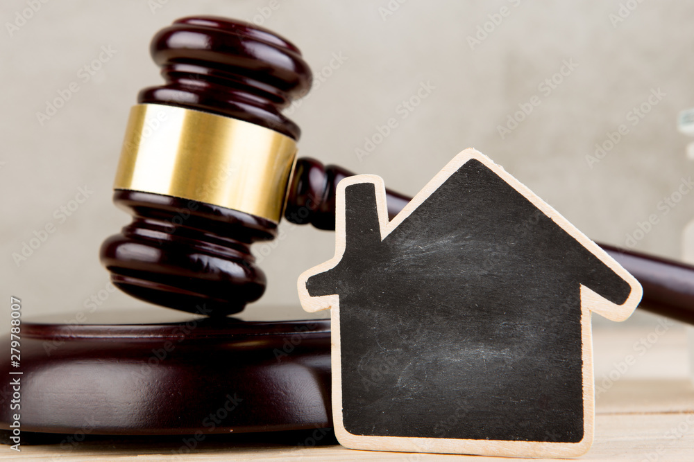 Real estate concept -auction gavel and little house with copy space
