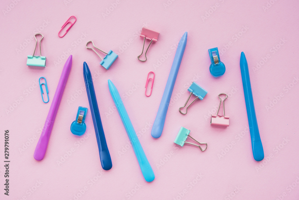 Top view of stationery accessories against pink surface Top view of stationery accessories against pink surface