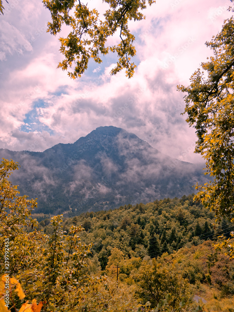 cloudy sky and yellow foliage, fall on Peloponnese Helmos mountains, Greece