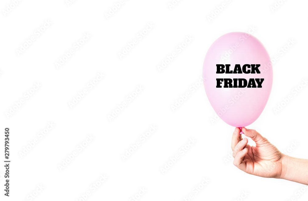 Black Friday inscription on pink balloon in hand isolated on white background. Black Friday inscription on pink balloon in hand isolated on white background.
