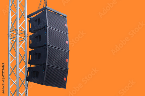 Black speaker hanging on a stand / Sound System in concert. Clipping path.