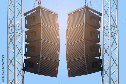 Black speaker hanging on a stand / Sound System in concert. Clipping path.