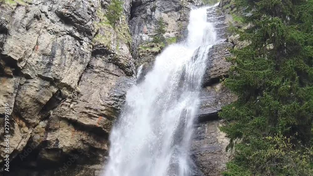 Spring time waterfall in the Carpathian mountains, Romania, formed after the snow on the peaks has melted creating powerful water stream , slow motion video Spring time waterfall in the Carpathian mountains, Romania, formed after the snow on the peaks has melted creating powerful water stream , slow motion video