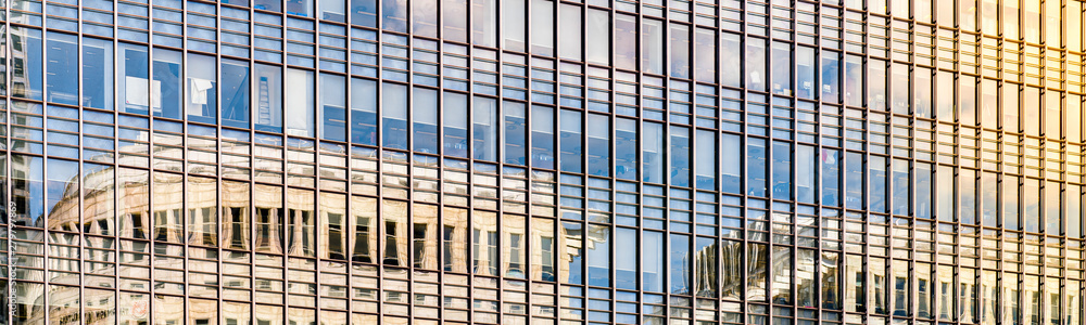 Modern city building architecture with glass fronts on a clear day in London, England at sunrise panoramic Modern city building architecture with glass fronts on a clear day in London, England at sunrise panoramic