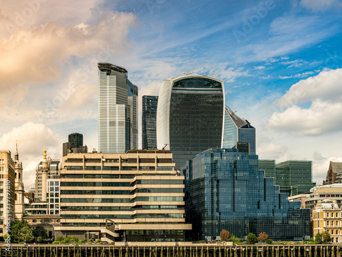London skyline at sunset with a dramatic sky in the business district overlooking the Thames river