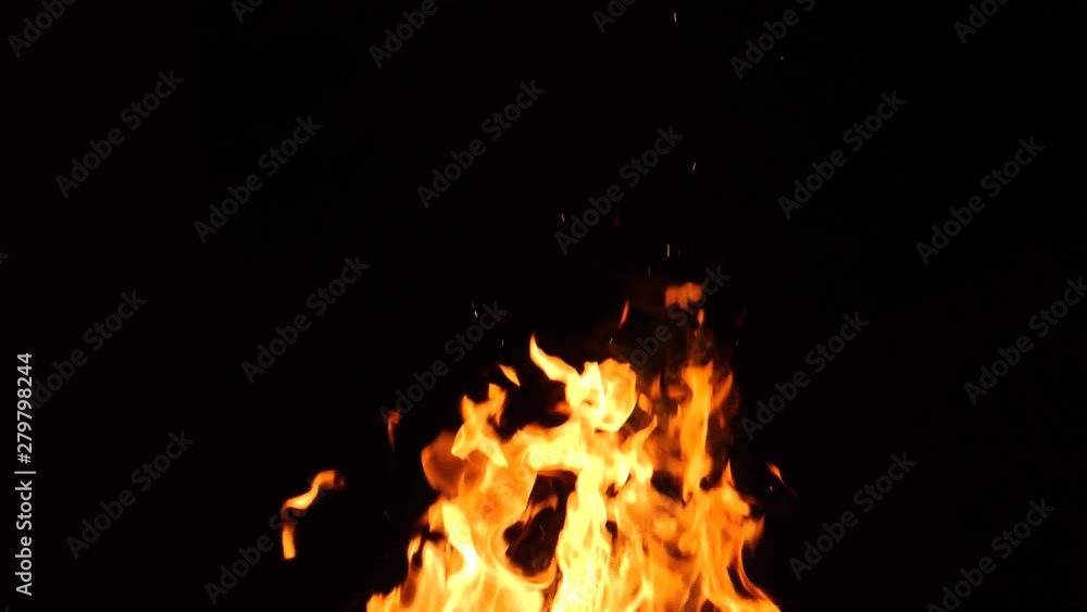 Close-up of burning fire, flames burning on black background, slow motion Close-up of burning fire, flames burning on black background, slow motion