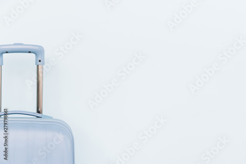 Close-up of blue luggage bag on white background