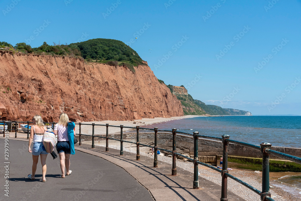 Sidmouth, Devon, England, UK. July 2019.  The seafront with a backdrop of Jurassic Cliffs at Sidmouth East Devon.