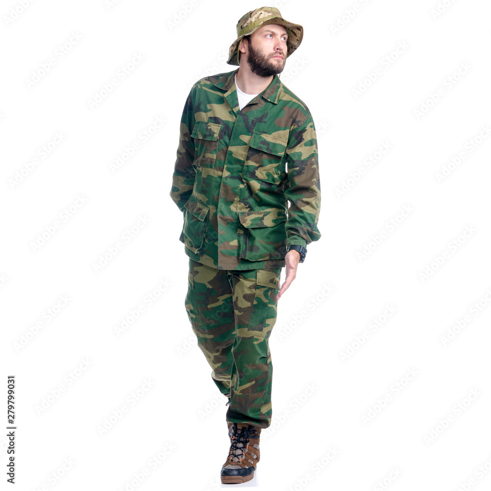 Man in camouflage clothes hiking walking goes on white background isolation Man in camouflage clothes hiking walking goes on white background isolation