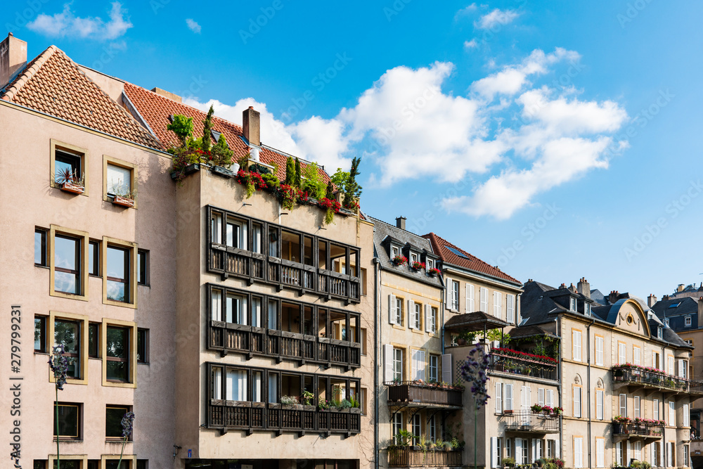 apartments with balcony and flowers, along canal in Metz, France