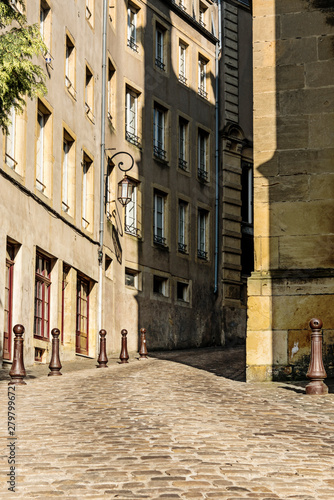small street with bollards in historical town Metz, France © Corinne