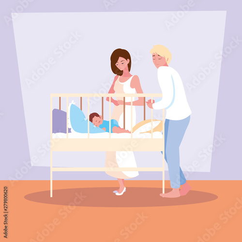 parents observing of baby boy sleeping