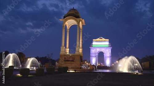 night shot of the historic canopy and fountains at india gate in new delhi, india photo