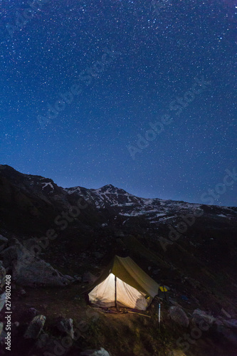 Camping under stars - Himalayan Forest. Star gazing from Deo Tibba trek,Manali, Himachal pradesh, India. Beautiful landscape and snow scape in cold winter terrain. Astro photo,galaxy, stars. Outdoors