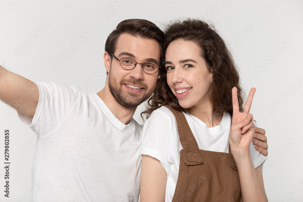 Webcam view girl showing victory sign makes photo with boyfriend Webcam view girl showing victory sign makes photo with boyfriend