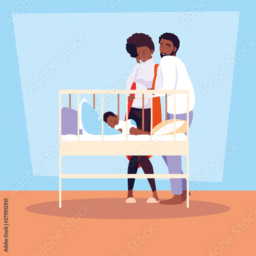 parents afro observing of baby boy sleeping