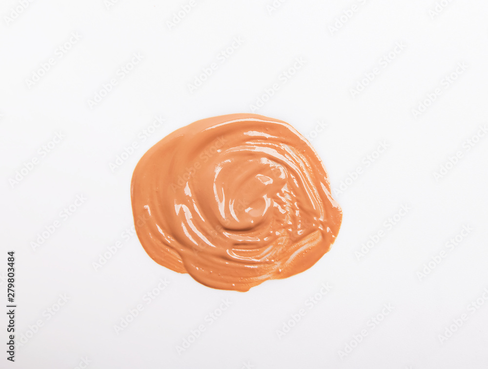 Makeup foundation smear of beige color isolated on white Makeup foundation smear of beige color isolated on white