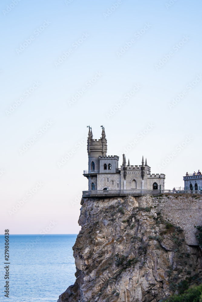 Castle Swallow Nest on a rock in the Black Sea. Yalta, Crimea, Russia. . Beautiful view of the Swallow Nest on a cliff in summer