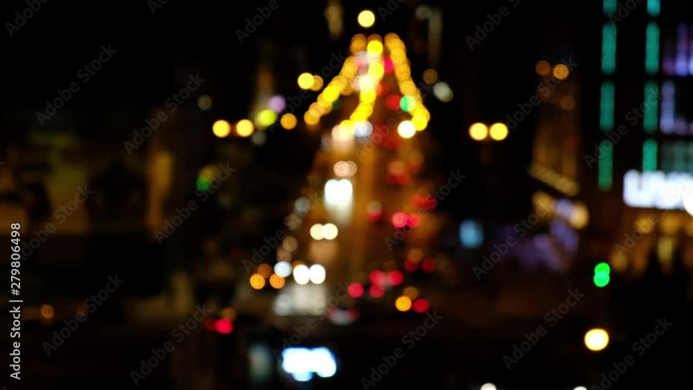 Defocused night city car traffic lights. Color blurred bokeh of moving transport and typical city view Defocused night city car traffic lights. Color blurred bokeh of moving transport and typical city view